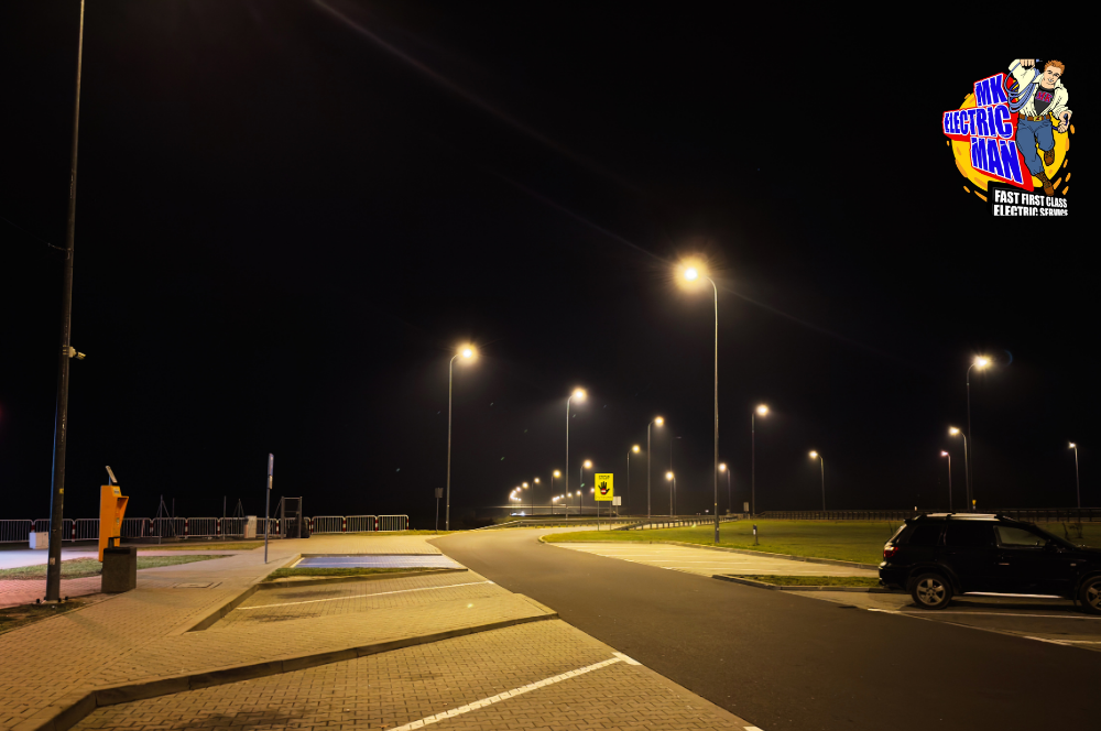 Commercial Electrician in Metairie Repairing Parking Lot Pole Lights on Veterans Blvd